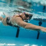 Female swimmer inside swimming pool